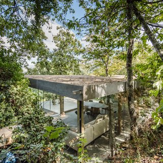 A Portuguese Glass House Uses Surrounding Foliage as a Privacy Screen - Photo 6 of 15 - The roof is the only solid element in the residence.