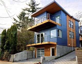 Perched on a steep urban hillside, this three-bedroom, two-bath home features energy-efficient elements including triple-glazed windows and FSC bamboo floors to achieve LEED Platinum certification. Even the home's garage was designed to be sustainable, as it is prewired for electric charging. The design’s emphasis on livability and openness are also reflected by ample outdoor terraces, as well as the flexible basement.
