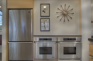 Although the kitchen has been renovated, it still maintains the primary tenets of Breuer's design with a modern, midcentury feel.