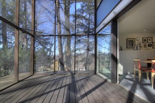 The glazed porch acts as a buffer between the interior and exterior.