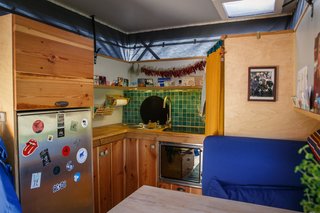 The kitchen countertops connect the travelers to their former residence in Berlin; the wood was taken from a neighbor's house and was slated for the dumpster. The pine was instead rescued and used to create the kitchen countertops and cabinet doors.