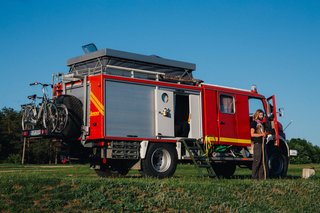 The top was lifted off the truck, and extra storage for items like bikes was added to the exterior.