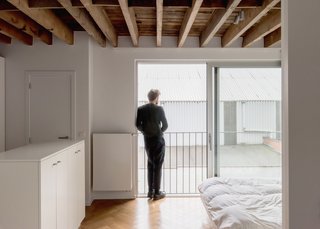 Bedrooms on the upper floors maintain the neutral palette established on the levels below.