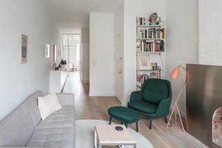 Thanks to the glazed partition, views from the living room continue directly into the kitchen area and bedroom.