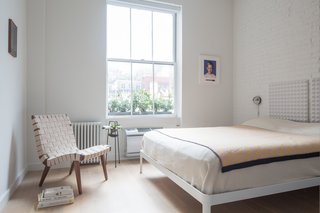 Located at the opposite end of the apartment from the living room, the bedroom remains light and bright throughout the day.