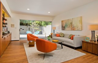 Off of the living room is a den that could easily be converted into a master bedroom, and is complete with its own private entrance and private patio. 
