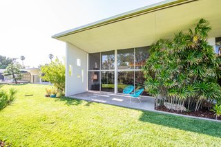 The backyard covers more than half an acre, and features a pool and a separate guesthouse.