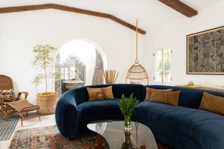 The curved shape of the sofa and its lush texture make for a modern but inviting seat.