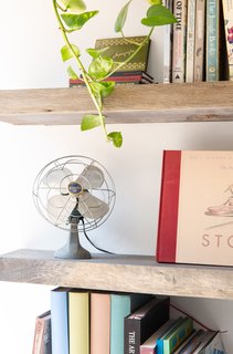 Items on the shelf were artfully arranged to show a mix of objects, art, and books.