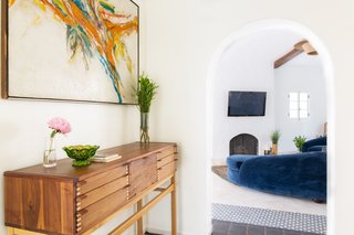 The entry gives way into the bright living room.