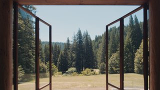 The doors and views open onto the outlying landscape.
