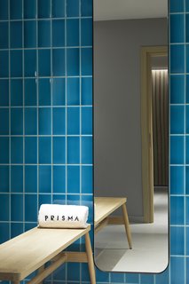The hotel's spa, with walls tiled in a calming blue tone, also uses products from a local company.