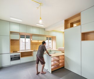Some of the storage pieces also double as tables and seating for guests and dining.