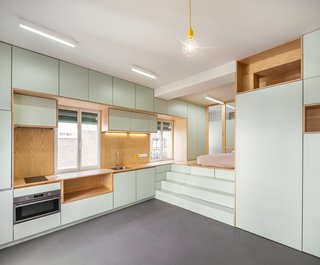 The light green cabinetry keeps Yojigen Poketto feeling bright, while the wood gives texture and a natural feeling to the space.