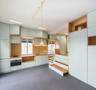 Ample storage is provided in the kitchen area and the steps leading up to the bed.