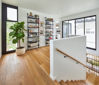The second floor is flooded with light; windows line the common corridor spaces.