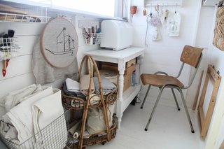 With efficient and varying storage solutions, this sewing shed for jewelry artist Artemis Russell mixes vintage finds with a variety of thoughtful but efficient storage solutions.