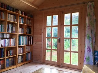 This library she shed comes as a kit from Australia-based SheShedz; in addition to its use as a library, the she shed also functions as a music room.