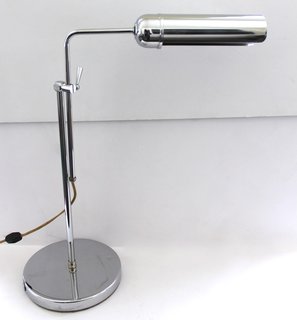 This adjustable chrome lamp makes a stylish addition to any desk.