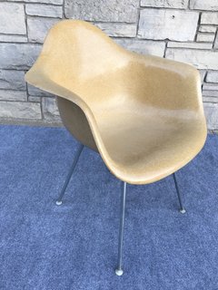 One of the most noted and exemplary pieces of midcentury design, the DAX chair was designed by Charles and Ray Eames for Herman Miller. 