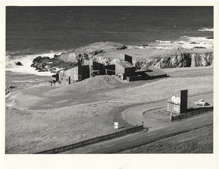 Condominium #1, one of the first buildings constructed at Sea Ranch, and south entrance marker along Highway 1 in 1965. The double wave or curlicue logo can be seen at the entrance marker and was frequently used on buildings and branding material throughout the community.