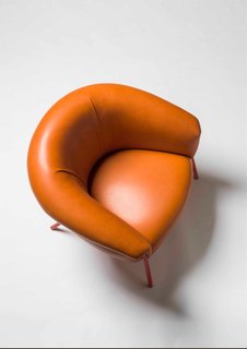 Stephen Burks' Grasso Lounge Chair for BD Barcelona x Bolon seems to overflow beyond its frame, oozing out leather or couture textiles that were developed in collaboration with Swedish brand Bolon, depending on the selected textile.