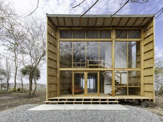 The funnel forms on either side of the building come together at the middle, where a lofted area for bedrooms is located.