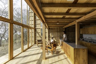 The kitchen's open plan allows residents to look outside to the water while preparing a meal.