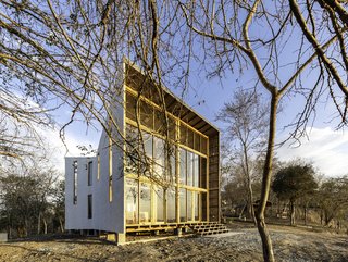 The home is simple in plan, but intriguing in form; its funnel shape not only emphasizes views and allows for cross-ventilation, but also helps shed water in inclement weather.