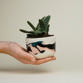 Working out of her studio space in Brooklyn, potter Helen Levi makes handcrafted pieces that have her hallmark marbling of different clay bodies.