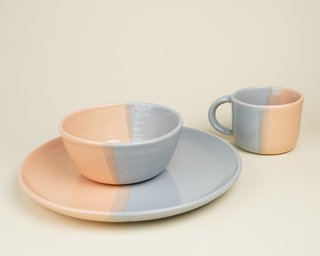 A dipping technique is used to glaze this set of dishware by potter Helen Levi.