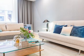In her interior design work, Marie Burgos seeks to pair straight lines with curves, and hard surfaces, such as wood or glass, with plush ones such as rugs and upholstery. These factors need to be complemented by a great lighting scheme for optimum effect. 