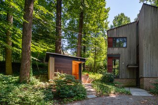Treehouse Shed by Gardner Architects LLC is part of a masterplan that manages stormwater, creates a habitat for indigenous species, and embraces the neighboring trees—thereby preserving the quality of the community.