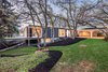 Modern home with Exterior, Wood Siding Material, House Building Type, Mid-Century Building Type, Glass Siding Material, and Flat RoofLine. Front Photo of An Eduard Dreier Home asked $1.2M