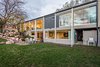 Modern home with Exterior, Flat RoofLine, Wood Siding Material, Glass Siding Material, and Mid-Century Building Type. Back Photo 7 of An Eduard Dreier Home asked $1.2M