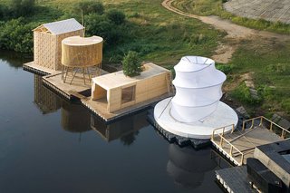 The firm's Kaluga Floating Sauna sits with other floating structures by Norman Foster, Francois Roche, Vladimir Plotkin, and others.