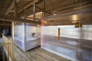 6 Well-Designed Hostels For the Minimalist Traveler - Photo 6 of 6 - The interior features gabled volumes feature with timber frames clad with translucent polycarbonate, making them lightweight and portable. 