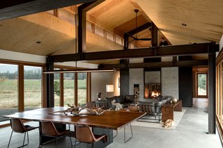 A set of hidden steel stairs lead to a loft above the library. 
