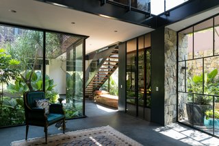 50 Modern Homes With Floor-to-Ceiling Windows - Photo 31 of 50 - Designed by architect Andrés Escoba, Casa OM1 in Guadalajara, Mexico, is built for modern-day living, with spaces that balance technology, comfort and, luxury.