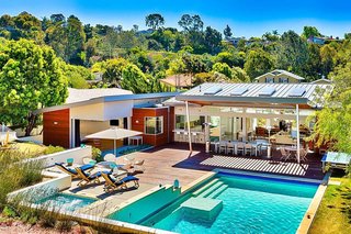 10 Modernist Beach Home Rentals to Escape to This Summer - Photo 3 of 10 - Designed by Tim Golba, this 3,400-square-foot home is walking distance to the La Jolla beaches. The home was constructed as a modernist oasis, with an emphasis on reflecting the peace and tranquility of the La Jolla landscape. The home features disappearing glass walls and a spacious, minimalist interior aesthetic that unites concrete and glass under soaring ceilings and extended outdoor living areas. 