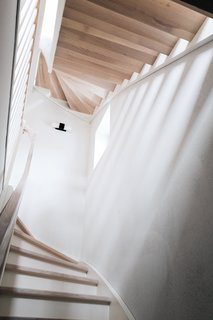 A Family’s Loft in Poland Gets a Minimalist Renovation That’s Both Elegant and Functional - Photo 4 of 12 -