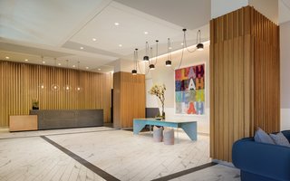 Tour a New Residential High-Rise That's Uniquely "Chicago" - Photo 5 of 11 - The building's lobby features Mel Bochner's "Blah Blah Blah" piece.