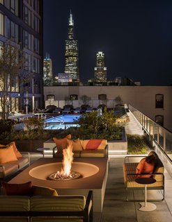 Tour a New Residential High-Rise That's Uniquely "Chicago" - Photo 10 of 11 - Fire pit and pool area 