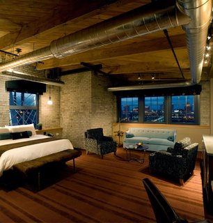 To minimize waste and reuse workable infrastructure, Aparium kept the original wood beams and steel pipes throughout The Iron Horse. Locally-produced textiles and artwork were also added to provide decorative accents in the rooms. 