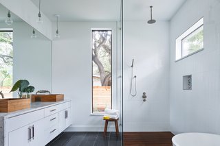 Davey McEathron Architecture installed slim windows to provide a light-filled, yet private, master bathroom in Chelsea House.