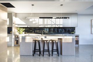 These 30 White Kitchens Are Anything But Ordinary - Photo 30 of 30 - The interior palette in the extension includes bespoke limed oak cabinetry from the kitchen to the bathroom, and is fabricated by local outfit Panorama Cabinets, polished concrete floors, and black steel accents, such as in the staircase and windows. 