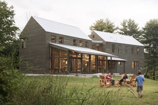 A Kennebunk family needed their forever home, and the old farmhouse and barn that stood on their property wasn't going to cut it. The architects at Caleb Johnson Studio started the process by salvaging everything they could from the old buildings, including the timber roof structure, interior wood cladding, and interior doors. Additionally, the architects also claimed cabinetry and fixtures from a midcentury home that was being torn down in Weston, Massachusetts. By incorporating such materials into the new home's design, they were able to create a modern farmhouse with soul. 