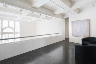 An upstairs gallery overlooks the living room.