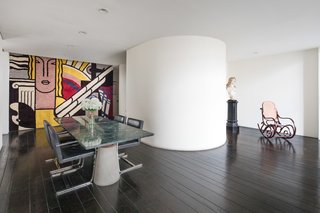 A close-up of the dining room with large-scale art