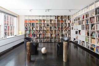 Lella Vignelli's office is lined with bookshelves. She designed the desk with legs fashioned by sculptor Arnaldo Pomodoro. The couple were known to host many cultural luminaries in the apartment, including Pomodoro and philosopher Umberto Eco.